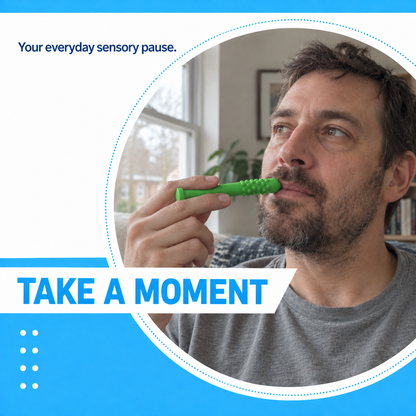 Man holding a green silicone sensory chew stick near his lips during a quiet break
