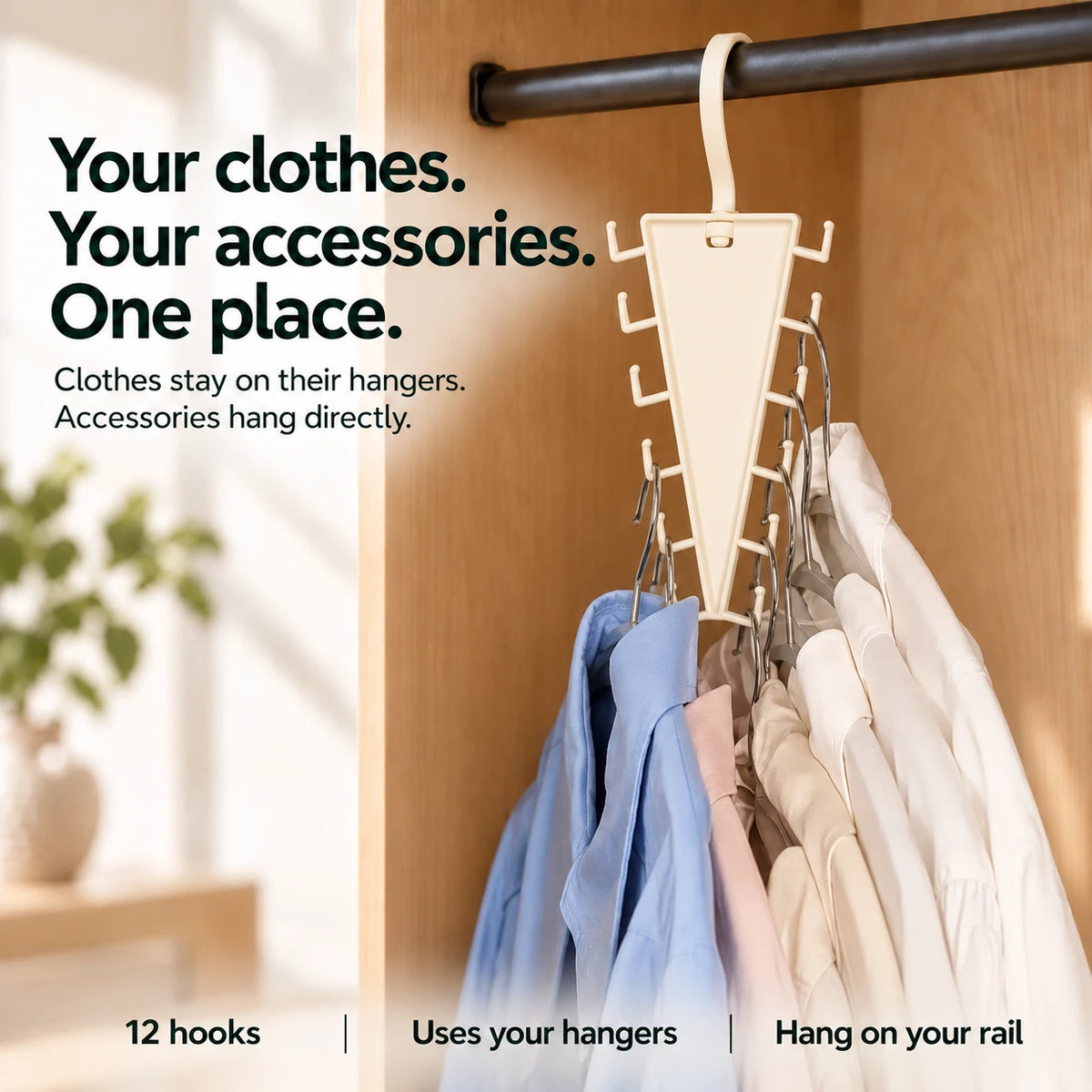 Blue, blush and ivory shirts supported on separate ordinary wire clothes hangers whose hooks rest on the organizer side pegs